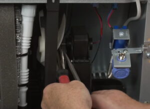 You can pull out the fan by using pliers and a flathead screwdriver as shown in the image below.